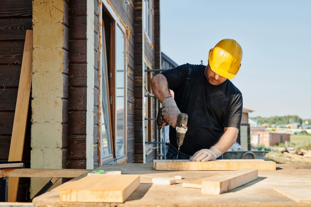 Man In A Black Shirt With A Power Tool